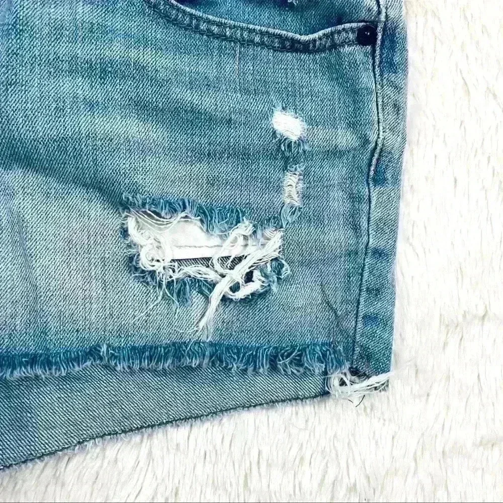 B By‎ Bullhead Med Wash Lowrise Distress Faded Cheeky Raw Hem Jean Shorts Size 9